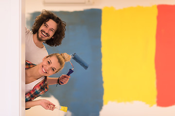 Image showing portrait of a couple painting interior wall