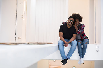 Image showing couple having break during moving to new house