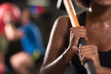 Image showing black woman after workout with hammer