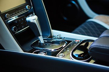 Image showing Detail of modern car interior, gear stick.