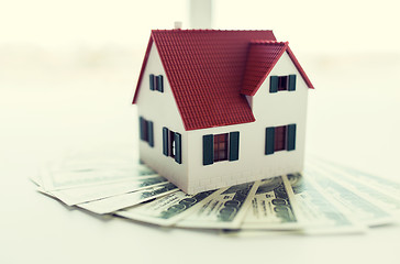 Image showing close up of home or house model and money