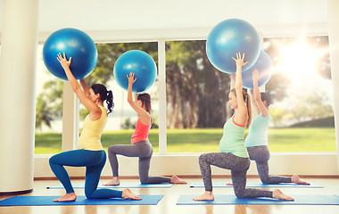 Image showing happy pregnant women exercising with ball in gym