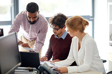 Image showing business team with tablet pc in office