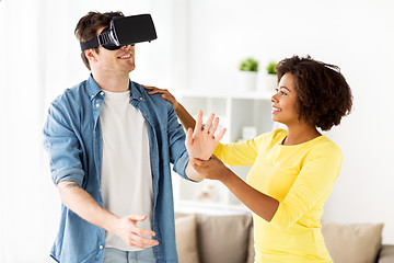 Image showing happy couple with virtual reality headset at home