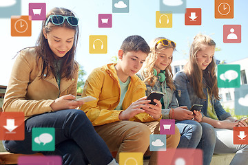 Image showing teenage friends with smartphone and headphones