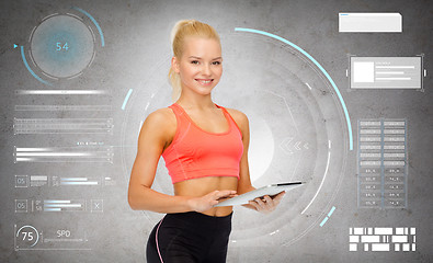 Image showing happy sporty woman with tablet pc computer