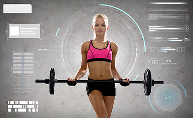 Image showing young sporty woman exercising with barbell