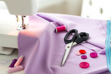 Image showing sewing machine, scissors, buttons and fabric