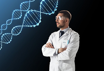 Image showing scientist in lab coat and safety glasses with dna