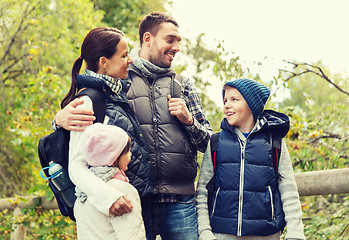 Image showing happy family with backpacks hiking