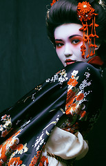 Image showing young pretty geisha in kimono