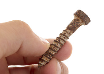 Image showing Rusted old screw isolated