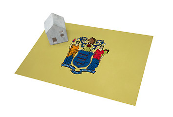 Image showing Small house on a flag - New Jersey