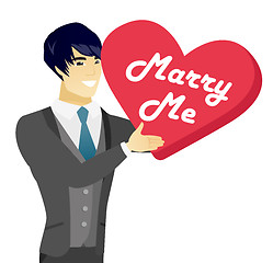 Image showing Young asian man making a marriage proposal.