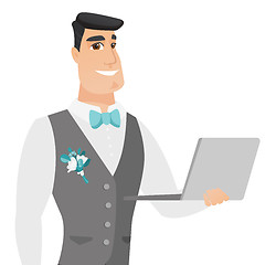 Image showing Young caucasian groom using a laptop.