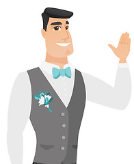 Image showing Young caucasian groom waving his hand.