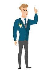 Image showing Groom with open mouth pointing finger up.