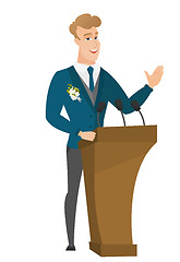 Image showing Caucasian groom giving a speech from tribune.