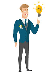 Image showing Groom pointing at business idea light bulb.