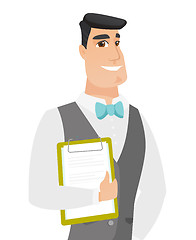 Image showing Caucasian groom holding clipboard with documents.