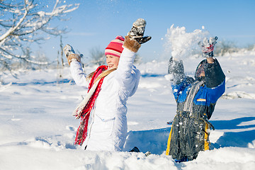 Image showing Happy little children playing  in winter snow day.