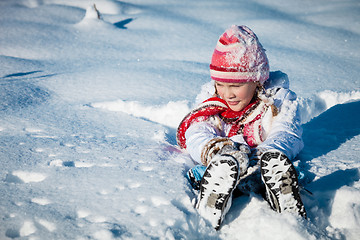 Image showing Happy little girl playing  on winter snow day.