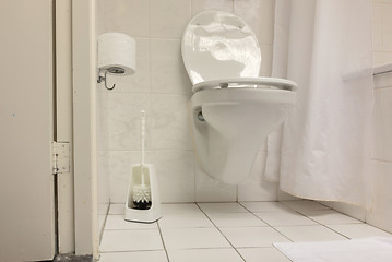 Image showing Toilet brush in a simple bathroom