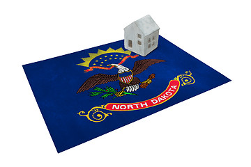 Image showing Small house on a flag - North Dakota