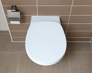 Image showing White toilet bowl in the bathroom