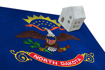 Image showing Small house on a flag - North Dakota