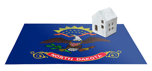 Image showing Small house on a flag - North Dakota