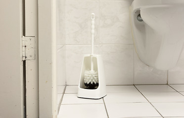 Image showing Toilet brush in a simple bathroom