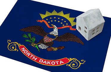 Image showing Small house on a flag - North Dakota