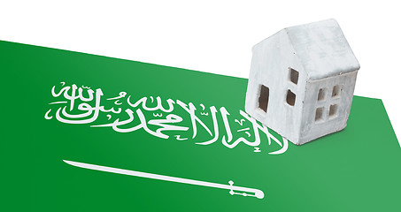 Image showing Small house on a flag - Saudi Arabia