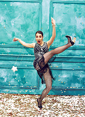 Image showing The studio shot of woman as retro dancer