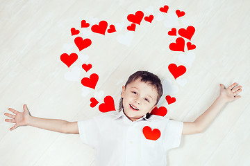 Image showing One little boy lying on the floor.