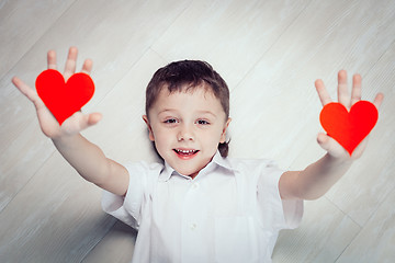 Image showing One little boy lying on the floor.