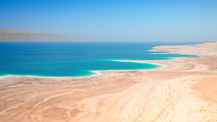 Image showing Dead Sea salt lake surface shore and beach