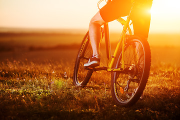 Image showing Sporty Man Riding a Bicycle on the Country Road.