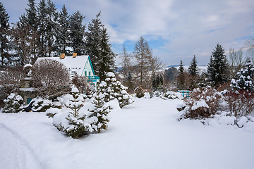 Image showing beautiful house in winter garden covered by snow