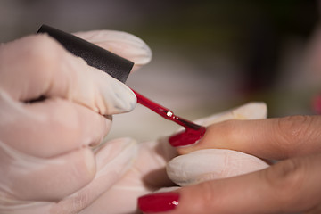 Image showing Woman hands receiving a manicure