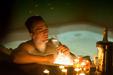 Image showing man relaxing in the jacuzzi