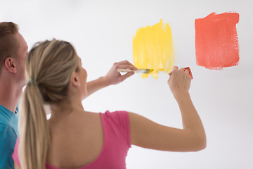 Image showing couple painting interior wall