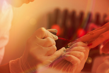 Image showing Woman hands receiving a manicure