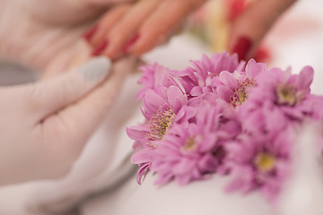 Image showing Woman hands receiving a manicure