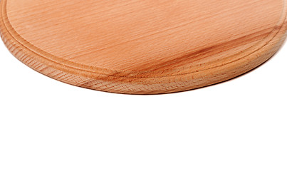 Image showing Round wooden kitchen board on white background