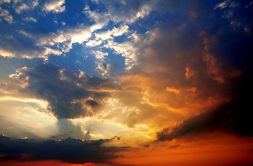 Image showing Multicolor sunset sky with clouds and sun rays