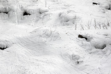 Image showing Off-piste slope with tracks from ski and snowboard