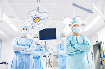 Image showing group of surgeons in operating room at hospital