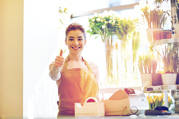 Image showing florist woman at flower shop showing thumbs up 